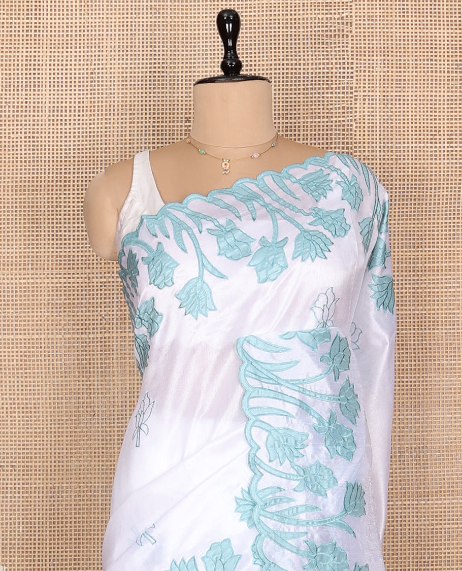 White Fancy Tussar Saree, Elegantly Highlighted with Floral Vine Embroidery, a Scallop Border, and a Matching Blouse