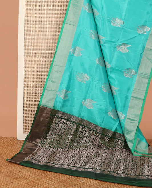 Blue zari buttas Uppada saree, bavanji border, and contrast intricately designed pallu