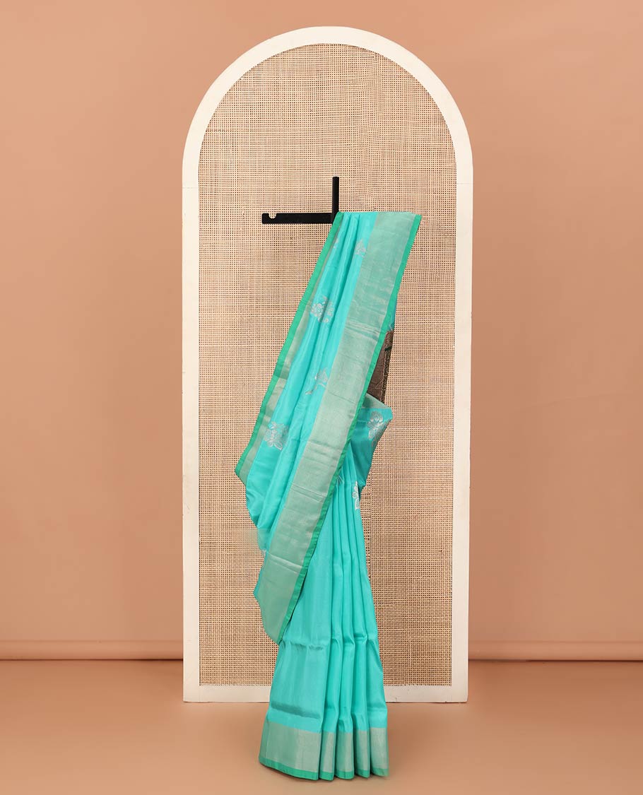 Blue zari buttas Uppada saree, bavanji border, and contrast intricately designed pallu