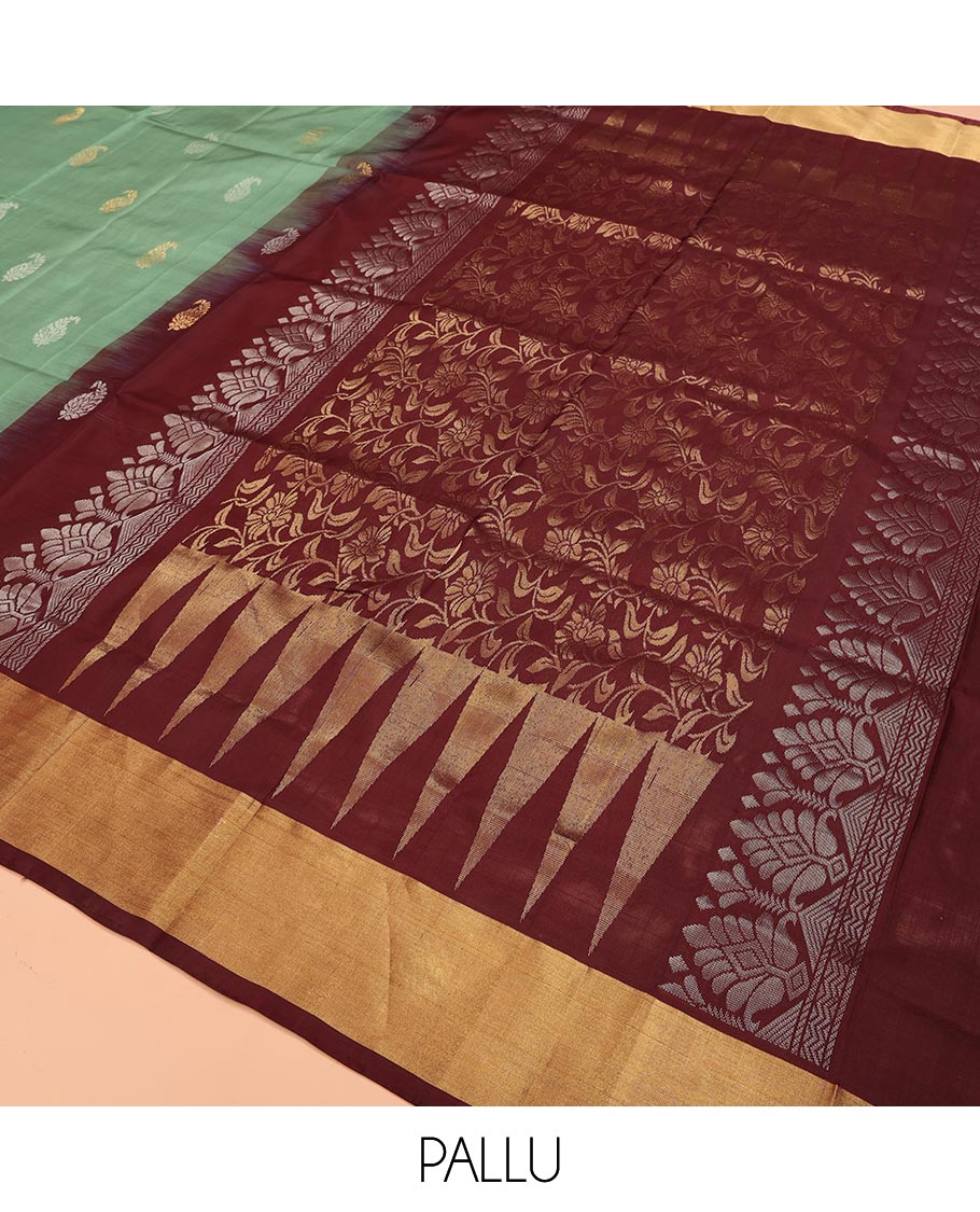 Green Uppada Silk Saree Accentuated with Paisley Buttas, Subtle Contrast Border of Temple Gopuram Motifs, Captivating Pallu Featuring Floral Jaal Design, and Paired with a Contrast Blouse