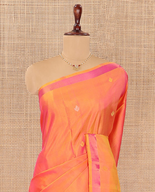 Orange Uppada Silk Saree Decorated with Zari Buttas, Complemented by Bavanji Border, Pallu Depicting Floral Motifs, and Paired with a Matching Blouse