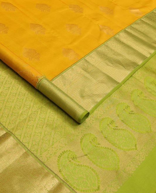 Yellow zari buttas Vasundhara silk mix saree, contrast border of muthu, mayil, kamalam, jaal designs, and pallu of kodi visiry designs