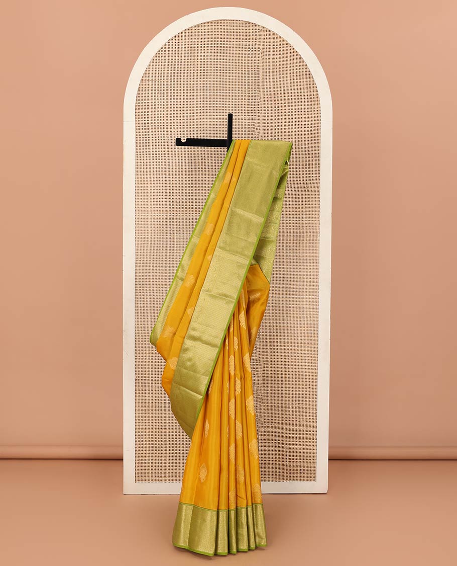 Yellow zari buttas Vasundhara silk mix saree, contrast border of muthu, mayil, kamalam, jaal designs, and pallu of kodi visiry designs