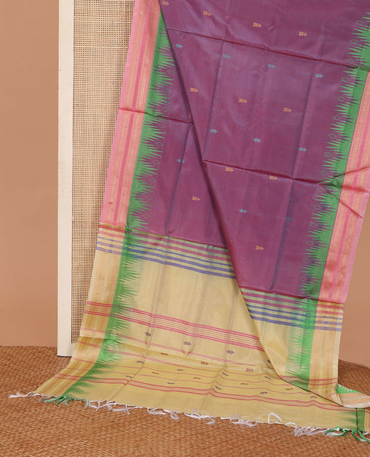 Purple buttas banana pith saree, contrast temple traditional zari border, and pallu of stripes, and buttas