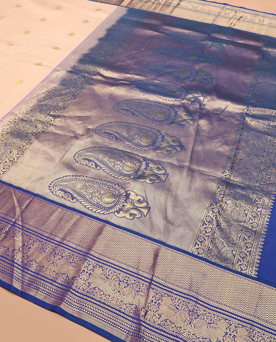 Light sandal zari buttas silk saree, contrast border of vanki, banaras, muthu, kathir, and Pichwai cow motifs zari weave, and pallu of manga designs