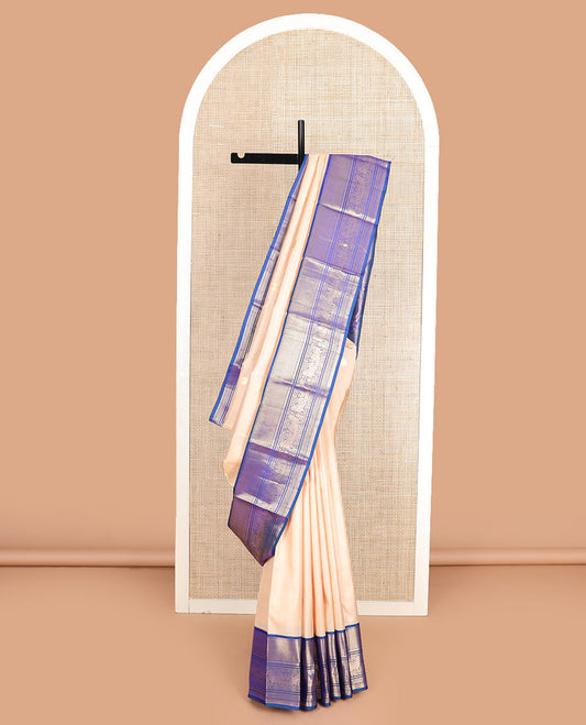 Light sandal zari buttas silk saree, contrast border of vanki, banaras, muthu, kathir, and Pichwai cow motifs zari weave, and pallu of manga designs