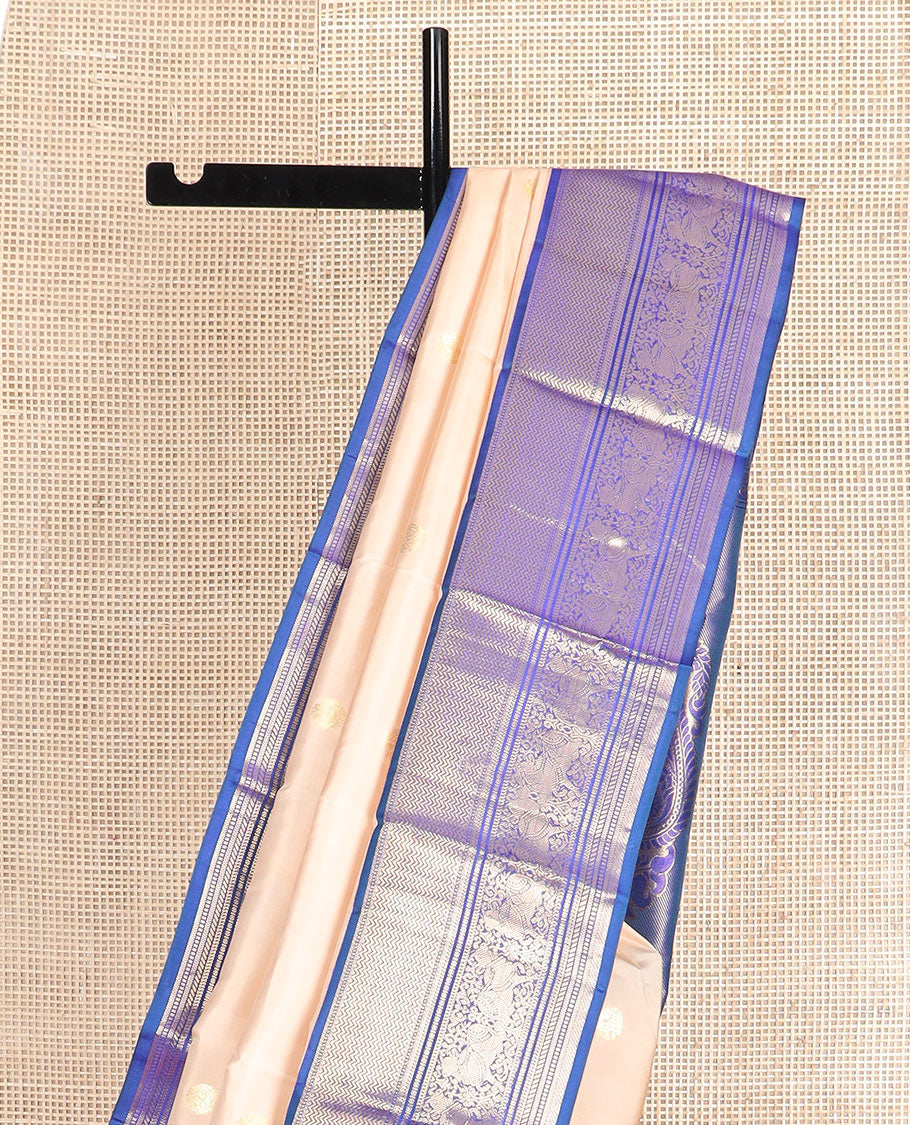 Light sandal zari buttas silk saree, contrast border of vanki, banaras, muthu, kathir, and Pichwai cow motifs zari weave, and pallu of manga designs