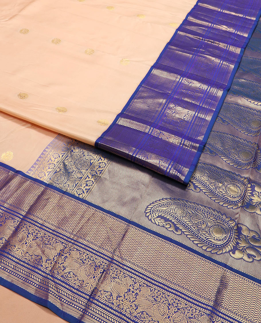 Light sandal zari buttas silk saree, contrast border of vanki, banaras, muthu, kathir, and Pichwai cow motifs zari weave, and pallu of manga designs