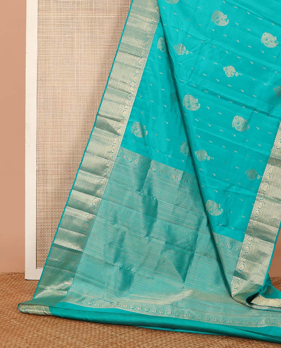 Blue zari buttas silk saree, zari border and pallu steeped with rekku, mayil, rudraksham, manga, kathir, cross neli and laddu kamalam