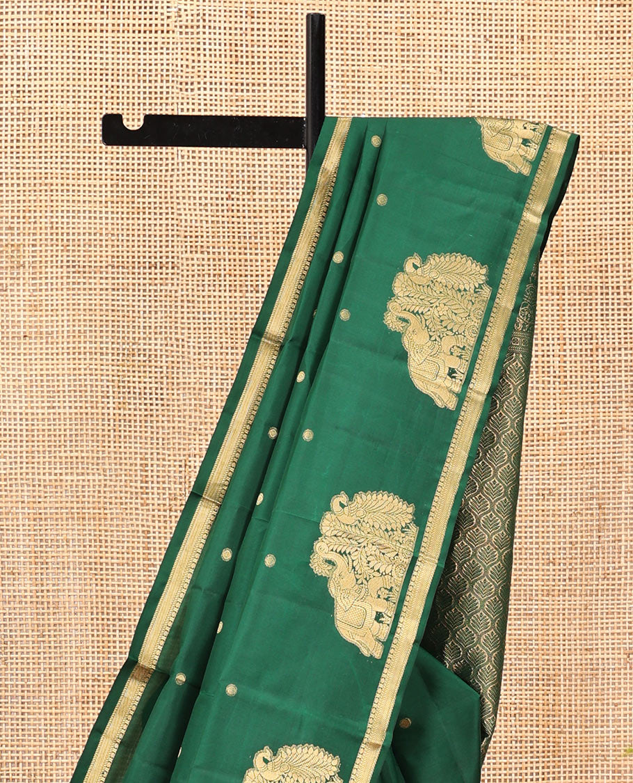 Green Vasundhara Silk Saree, Majestically Detailed with Zari Buttas and Mayil-Yaanai Buttas, a Subtle Zari Border, Jaal Pallu, and a Matching Blouse