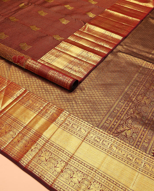 Maroon singam buttas woven kanchipuram silk saree, zari border of muthu, banaras, manga kodi, yaali, kuthirai, yaanai, mayil kann, rudraksham, and iruthalai pakshi, and jaal pallu