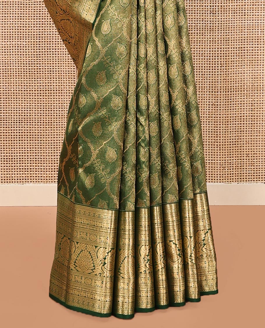 Green Kanchipuram Wedding Silk Saree, Elevated with Jacquard Designs on Its Body, Highlighted by a Traditional Zari Border of Kuthirai, Chakram, and Mayil Designs, Pallu of Greek Key Designs, and Paired with a Matching Blouse