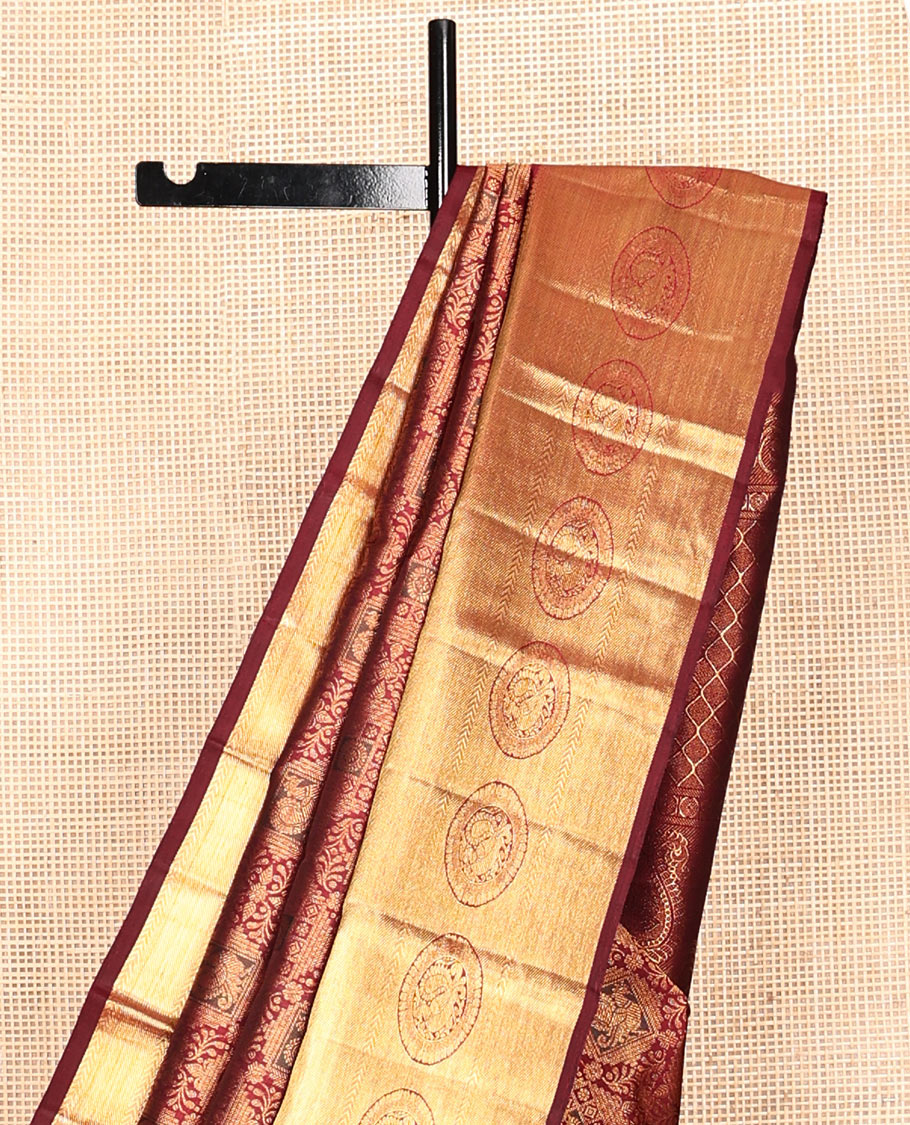 Maroon Kanchipuram Wedding Silk Saree, Decorated with Jacquard Design, Zari Border of Poo Chakram Designs, Grand Pallu, and a Matching Blouse
