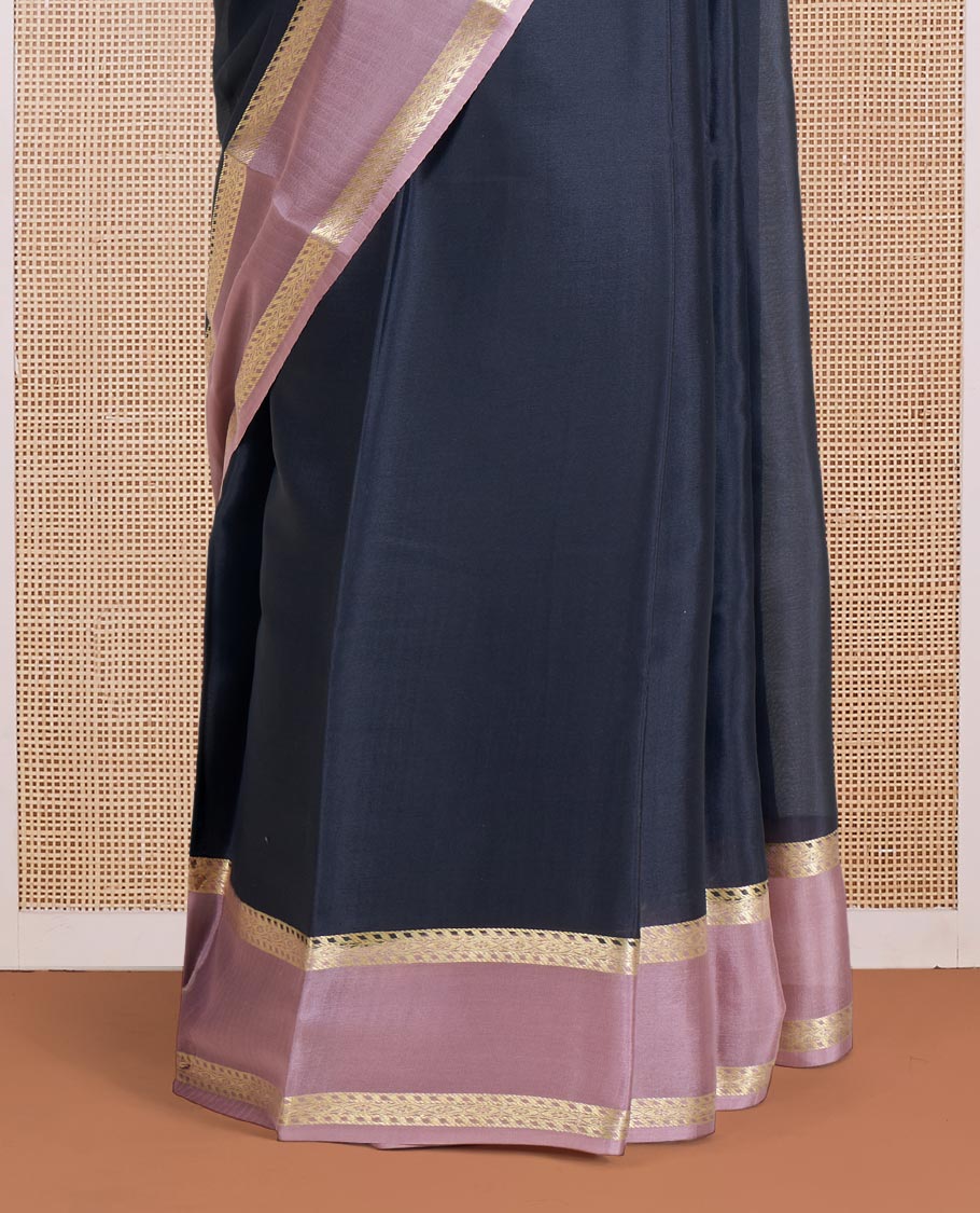 Black Plain Mysore Silk Saree, Complemented by a Contrast Rettai Pettu Border of Traditional Zari Designs, a Subtly Sparkled Pallu of Zari Stripes, and a Contrast Blouse