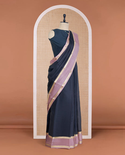 Black Plain Mysore Silk Saree, Complemented by a Contrast Rettai Pettu Border of Traditional Zari Designs, a Subtly Sparkled Pallu of Zari Stripes, and a Contrast Blouse