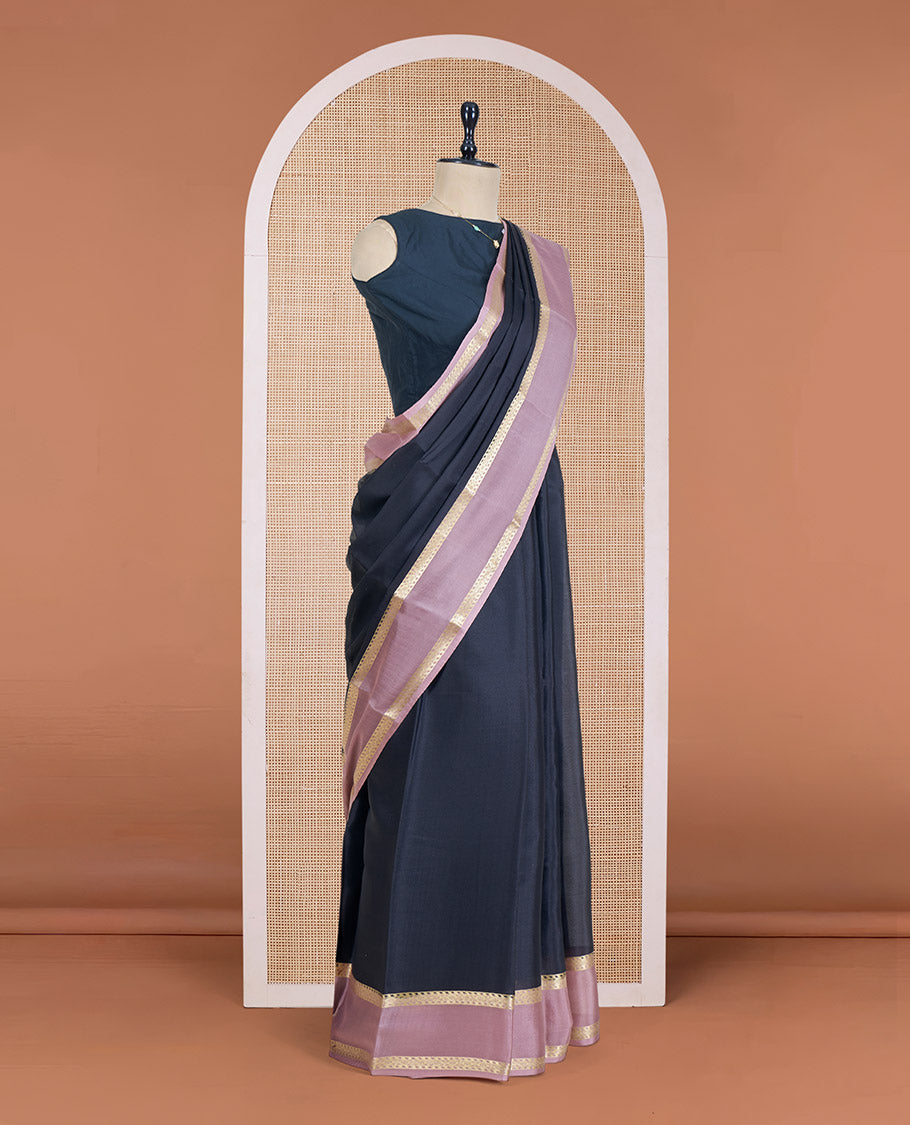 Black Plain Mysore Silk Saree, Complemented by a Contrast Rettai Pettu Border of Traditional Zari Designs, a Subtly Sparkled Pallu of Zari Stripes, and a Contrast Blouse