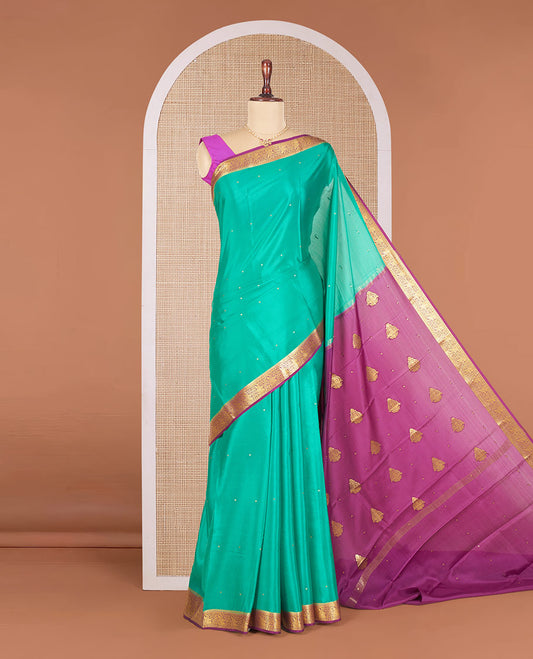 Persian Green Mysore Silk Saree Accentuated with Zari Buttas All Over the Saree, Complemented by Contrast Border of Paisley Designs, Pallu Steeped with Zari Buttas, and Paired with a Contrast Blouse
