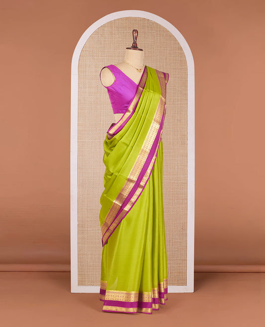 Parrot Green Plain Mysore Silk Saree, Complemented by a Contrast Temple Border of Jaal Designs, Pallu Steeped with Zari Stripes, and Paired with a Contrast Blouse