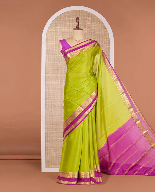 Parrot Green Plain Mysore Silk Saree, Complemented by a Contrast Temple Border of Jaal Designs, Pallu Steeped with Zari Stripes, and Paired with a Contrast Blouse