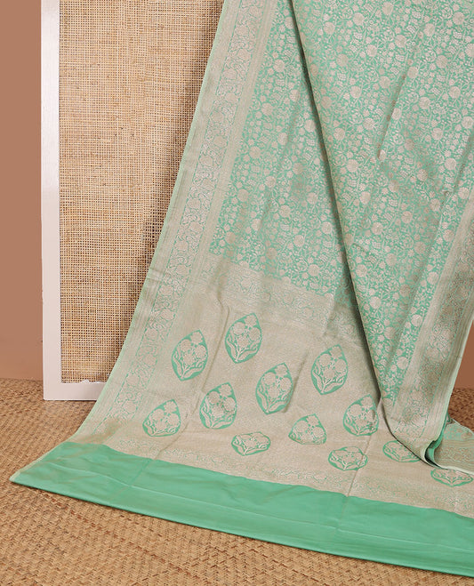 Green floral jacquard banaras silk saree with self border of zari design & floral design pallu