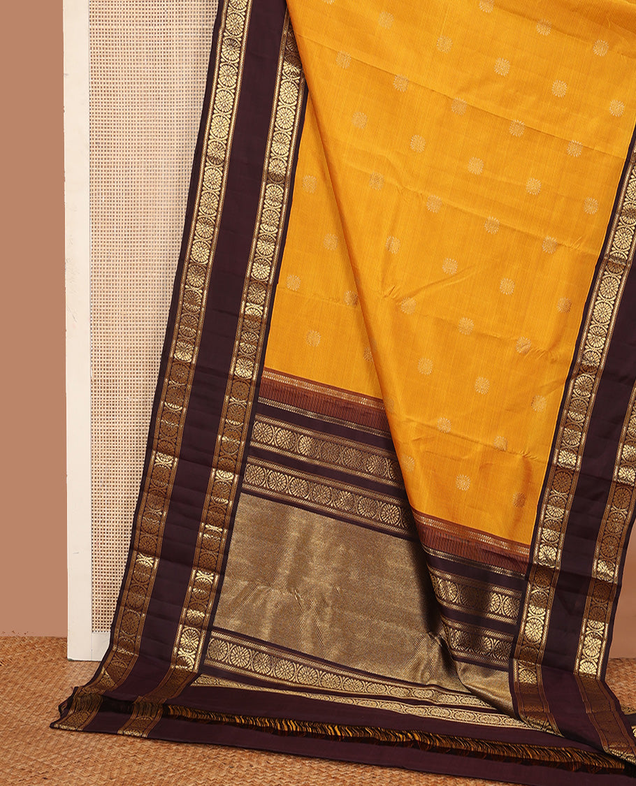 Mustard striped with chakram motifs Kanchipuram silk saree, contrast rettai pettu zari border of kathir, and poo chakram designs