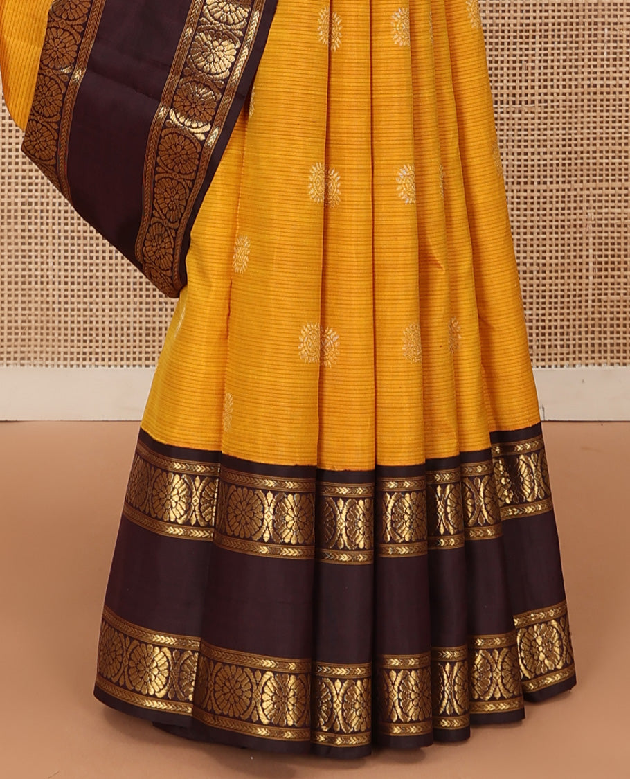 Mustard striped with chakram motifs Kanchipuram silk saree, contrast rettai pettu zari border of kathir, and poo chakram designs