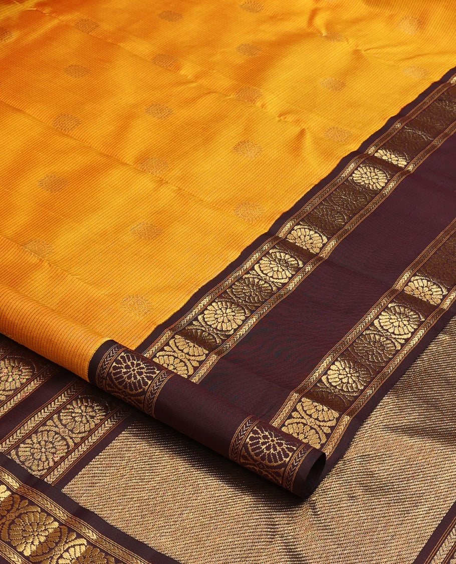 Mustard striped with chakram motifs Kanchipuram silk saree, contrast rettai pettu zari border of kathir, and poo chakram designs