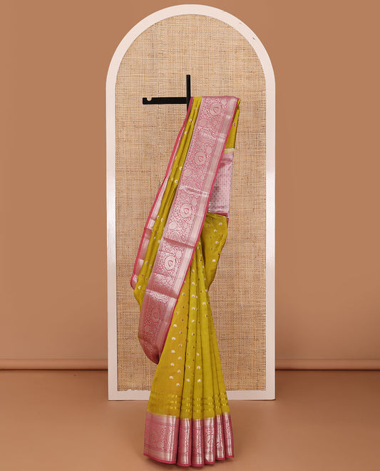 Green meena buttas raw mango silk saree, contrast traditional zari border of floral creeper, and jaal pallu