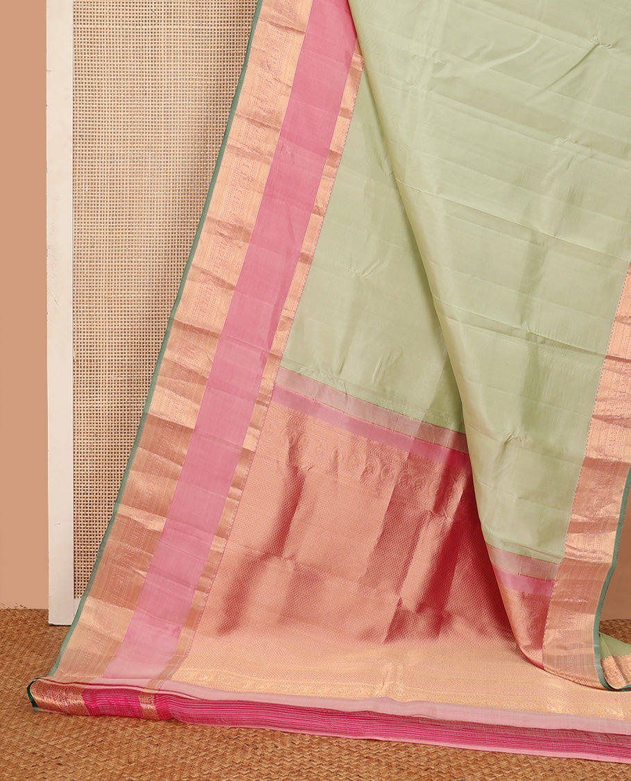 Tea green plain Kanchipuram silk saree, contrast rettai pettu border of muthu, kathir, kuyil kann,rudraksham, mayil, and kuthirai designs, and mayil kann pallu