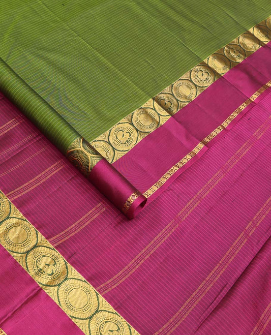 Green Kanchipuram Silk Saree, Sparsely Sparkled with Vazhaipoo Stripes, Complemented by Contrast Rettai Pettu Border of Round Mayil, and Paisa Designs, Zari Stripes Woven Pallu, and Paired with a Contrast Blouse