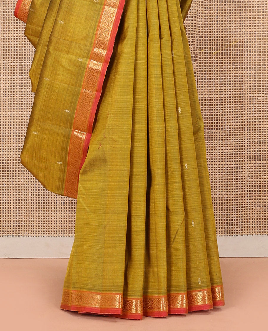 Green Kanchipuram Silk Saree Subtly Sparkled with Zari Buttas, Complemented by a Contrast Border of Jada Nagam Designs, Richly Zari Detailed Pallu, and Paired with a Contrast Blouse