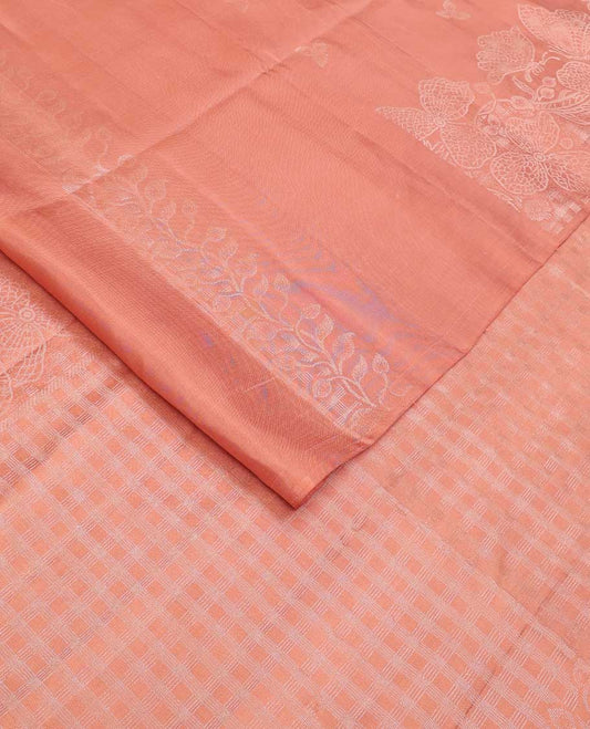 Peach three-leaf zari buttas soft silk saree, floral vine zari woven border, and zari-rich checked pallu
