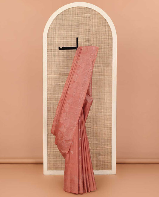 Peach three-leaf zari buttas soft silk saree, floral vine zari woven border, and zari-rich checked pallu