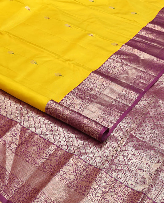 Yellow meena buttas silk saree, contrast border of thilakam,muthu,kuthirai, chakram & mayil kann & pallu of leaf designs
