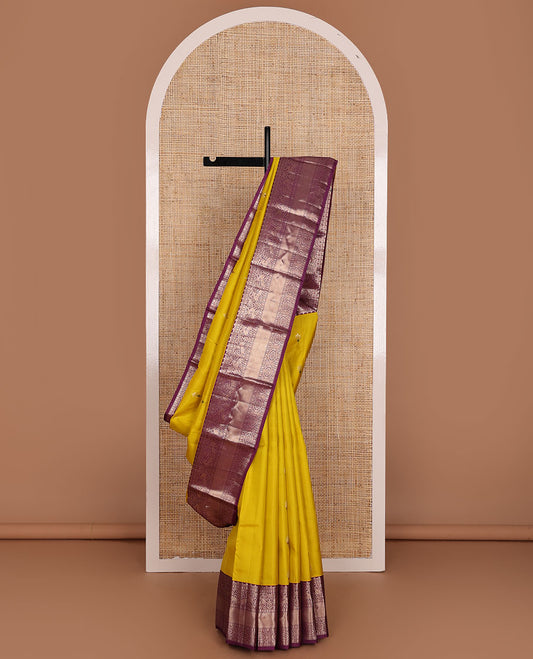 Yellow meena buttas silk saree, contrast border of thilakam,muthu,kuthirai, chakram & mayil kann & pallu of leaf designs