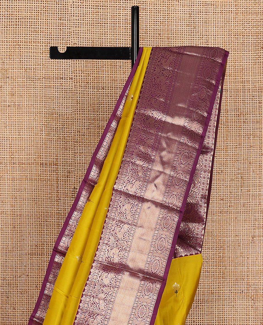 Yellow meena buttas silk saree, contrast border of thilakam,muthu,kuthirai, chakram & mayil kann & pallu of leaf designs