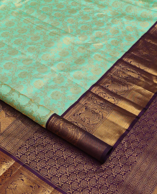 Turquoise jacquard wedding silk saree, contrast border of mayil, and iruthalai pakshi design, and floral design pallu
