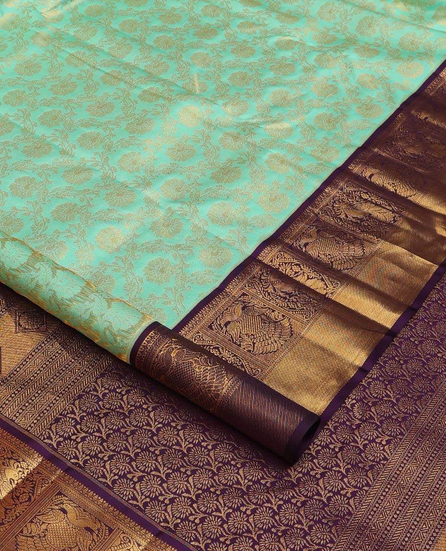 Turquoise jacquard wedding silk saree, contrast border of mayil, and iruthalai pakshi design, and floral design pallu