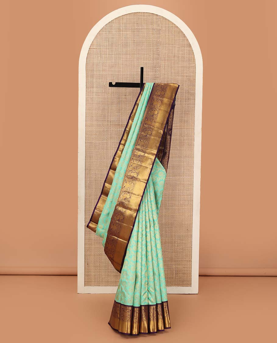 Turquoise jacquard wedding silk saree, contrast border of mayil, and iruthalai pakshi design, and floral design pallu