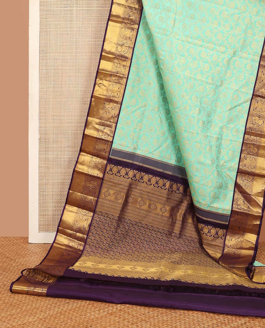 Turquoise jacquard wedding silk saree, contrast border of mayil, and iruthalai pakshi design, and floral design pallu