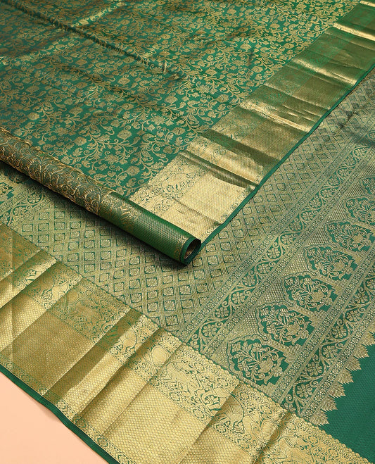 Green zari buttas woven kanchipuram silk saree, zari border of salngai, kamalam, yaali, yaanai, and mayil kann designs, and jaal pallu