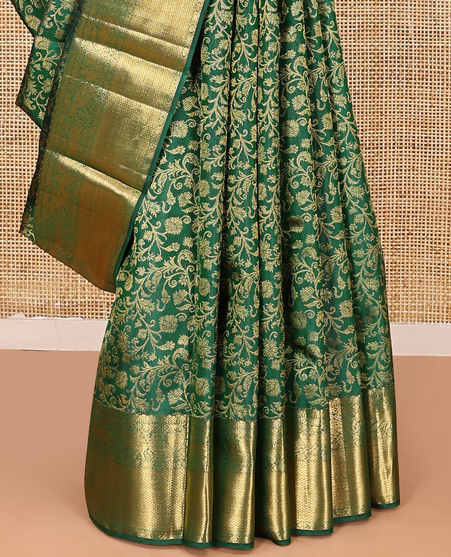 Green zari buttas woven kanchipuram silk saree, zari border of salngai, kamalam, yaali, yaanai, and mayil kann designs, and jaal pallu