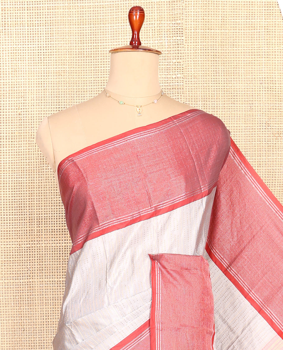 Grey Aarani Silk Saree, Subtly Sparkled with Zari Design All Over Its Body, Complemented by a Contrast Zari Striped Border, Striped Pallu, and Paired with a Matching Blouse