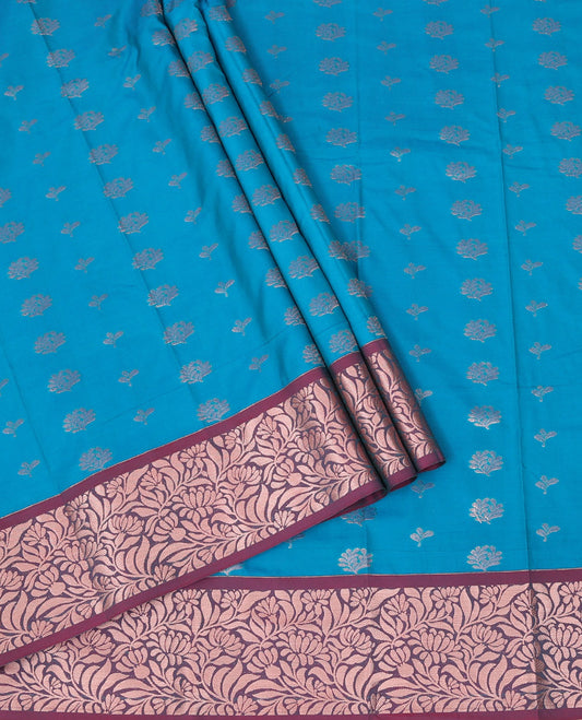 Blue Art Silk Pavadai Material Set, Woven with Floral Zari Buttas All Over Its Skirt, Highlighted with a Contrast Floral Jaal Zari Design Border, and Paired with a Contrast Blouse