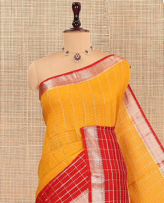Yellow Assam Silk Saree, Spotlighted with Zari Checked Design on Its Body, Complemented by Contrast Traditional Zari Design Border, Pallu Features Gleaming Zari Stripes, and Paired with a Contrast Blouse
