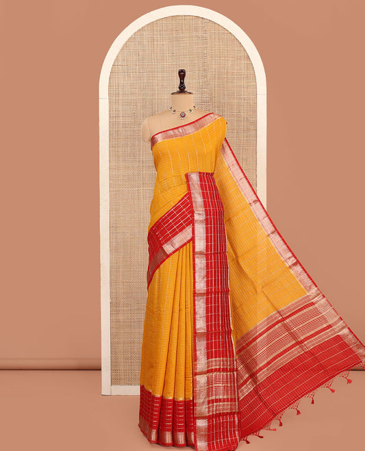 Yellow Assam Silk Saree, Spotlighted with Zari Checked Design on Its Body, Complemented by Contrast Traditional Zari Design Border, Pallu Features Gleaming Zari Stripes, and Paired with a Contrast Blouse