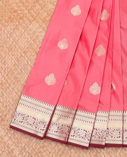 Pink Budget Silk Saree, Accentuated with Zari Buttas All Over Its Body, Complemented by Captivating Contrast Traditional Zari Designs Woven Border, Pallu of Peacock Eye Designs, and Paired with a Contrast Blouse