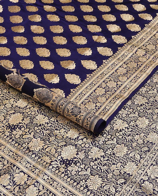 Navy blue banarasi silk saree with zari buttas, self-border of floral creeper designs & pallu steeped with floral designs