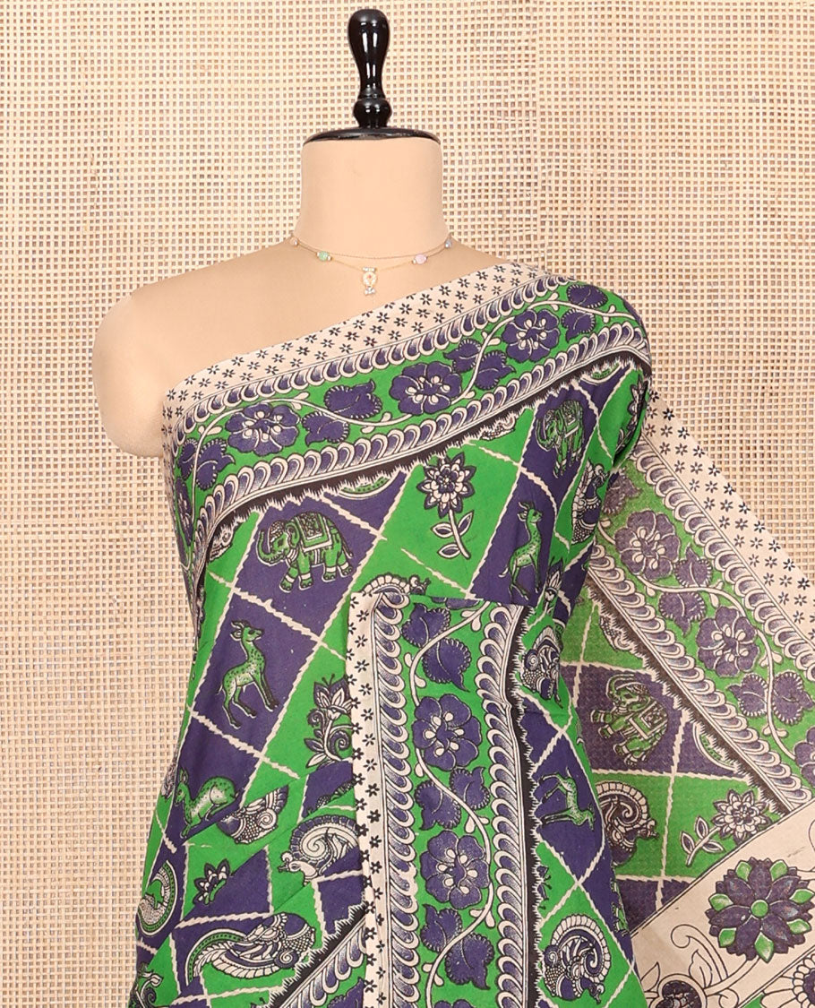 Blue-Green Machine-Printed Kalamkari Cotton Saree Features Butta Enclosed Jaal, Floral Printed Border, Pallu of Peacocks, and a Contrast Blouse
