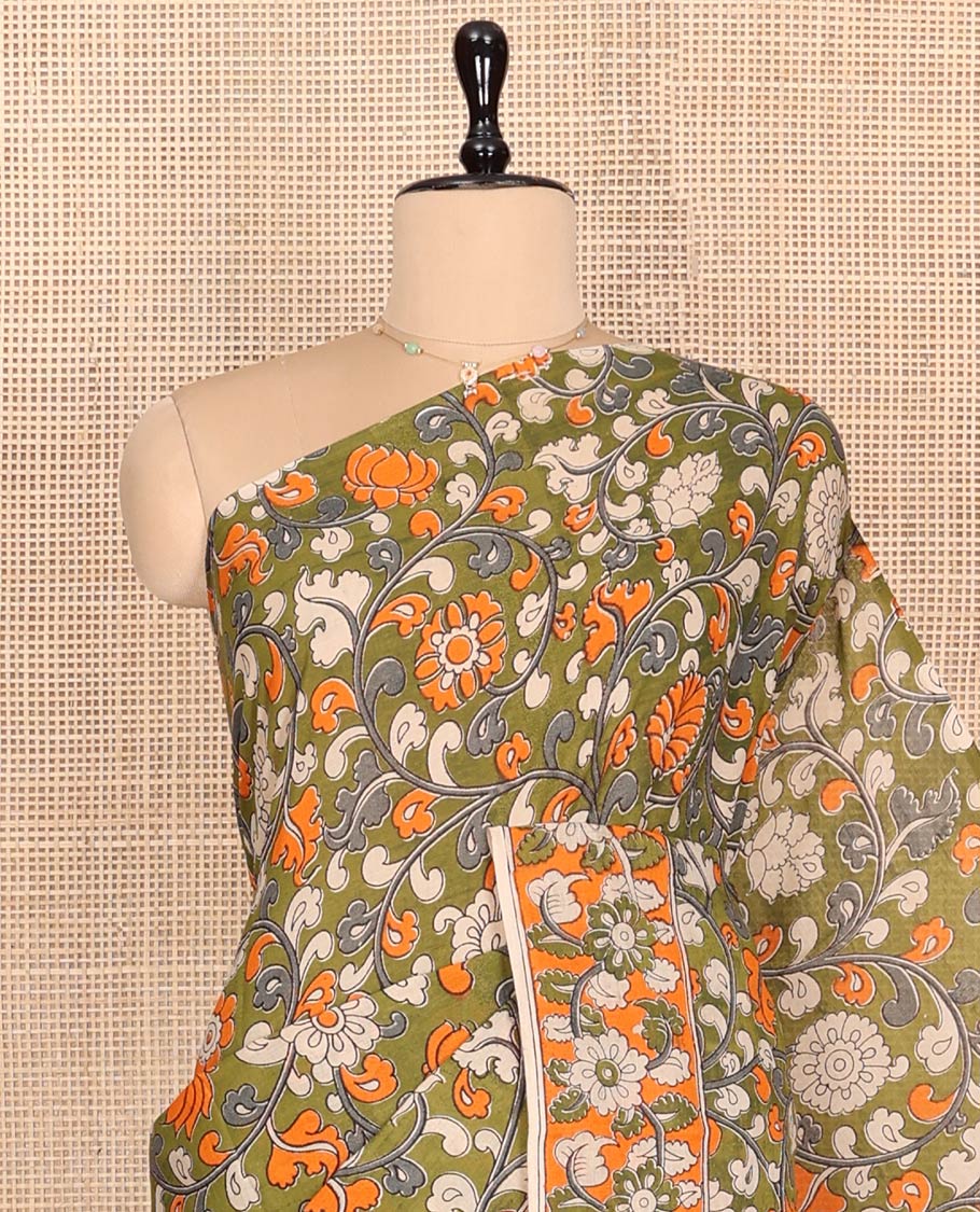 Green Machine-Printed Kalamkari Cotton Saree Features Floral Vine Design, a Floral Printed Border, Pallu of Fauna Motifs, and a Contrast Blouse